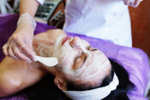 Woman receives a chemical peel facial.